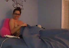 Shy nerdy girl masturbates under the sheets in pajamas
